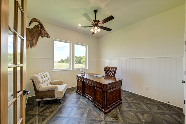 home office featuring dark parquet floors and ceiling fan