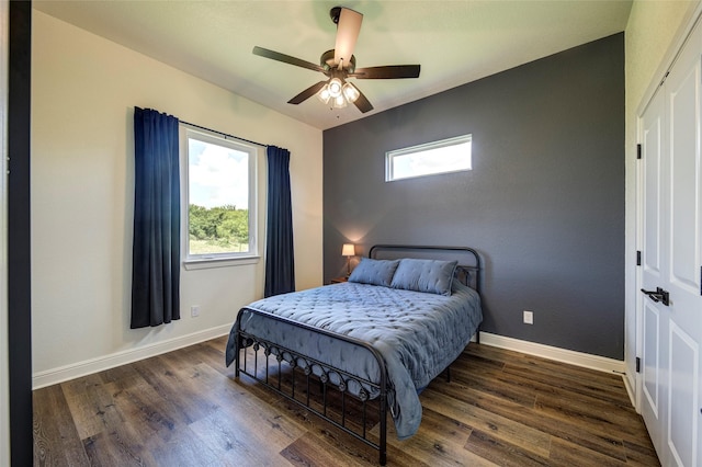 bedroom featuring dark hardwood / wood-style floors and ceiling fan