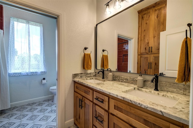 bathroom with vanity and toilet