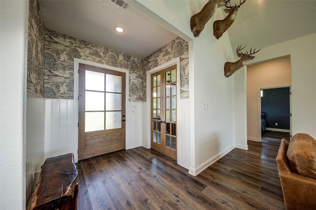 doorway featuring dark hardwood / wood-style flooring and french doors