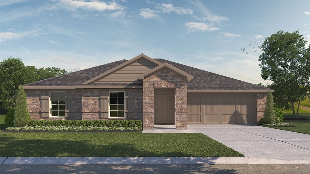 view of front of property with a front yard and a garage