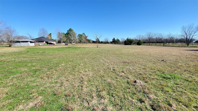 view of yard with a rural view