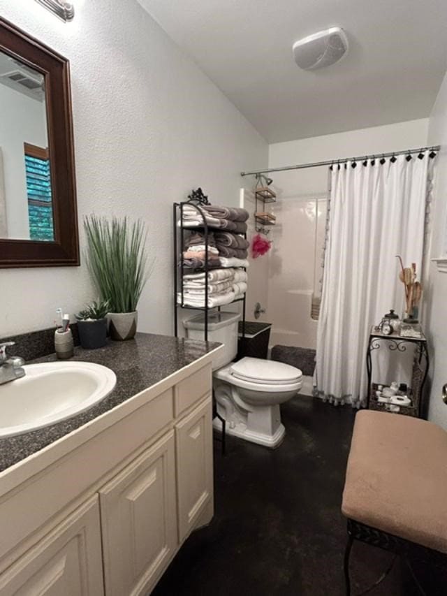 full bathroom with shower / bath combo, vanity, and toilet