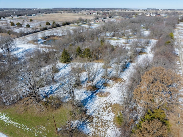 birds eye view of property with a rural view