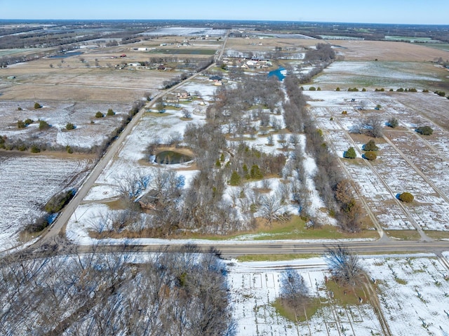 snowy aerial view with a rural view