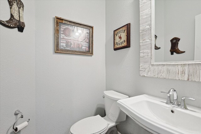 bathroom with sink and toilet