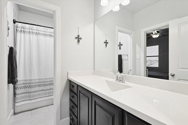 bathroom featuring ceiling fan and vanity