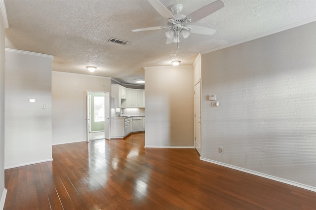 unfurnished living room with sink, hardwood / wood-style flooring, ceiling fan, crown molding, and a textured ceiling