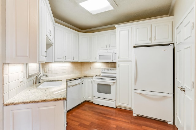 kitchen with white cabinetry, white appliances, sink, and dark wood-type flooring