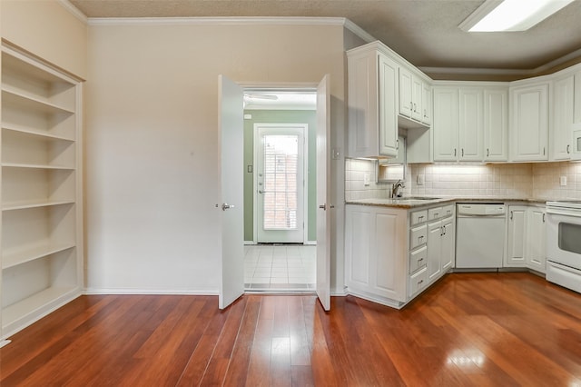 kitchen featuring dark hardwood / wood-style flooring, ornamental molding, white cabinets, and white appliances