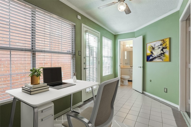 office space featuring ceiling fan, light tile patterned floors, a textured ceiling, and ornamental molding