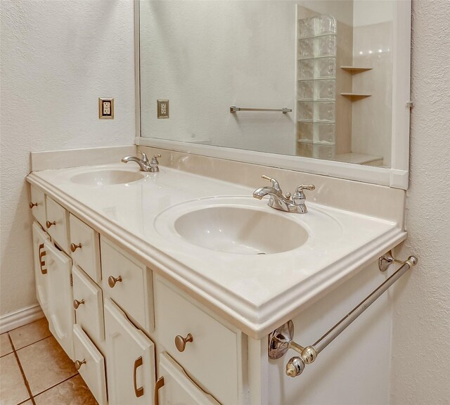 bathroom with tile patterned flooring and vanity