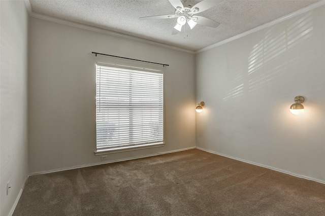 spare room with dark colored carpet, ornamental molding, ceiling fan, and a textured ceiling