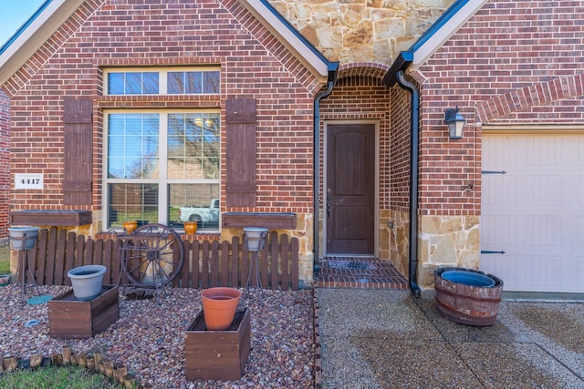 doorway to property featuring a garage