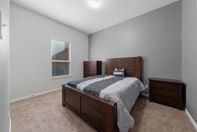 bedroom featuring light carpet