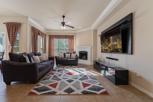 tiled living room featuring ceiling fan and ornamental molding