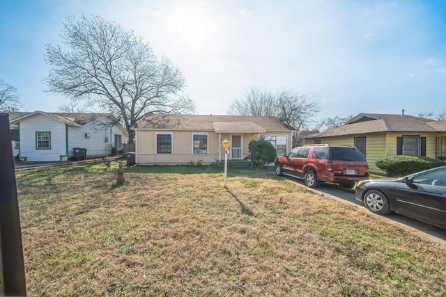 ranch-style house with a front lawn