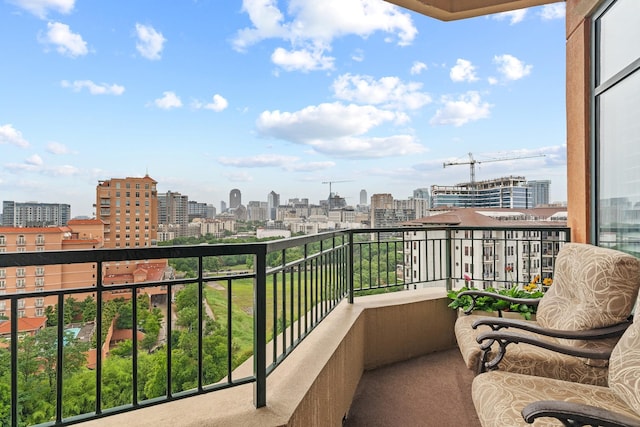 balcony featuring a city view