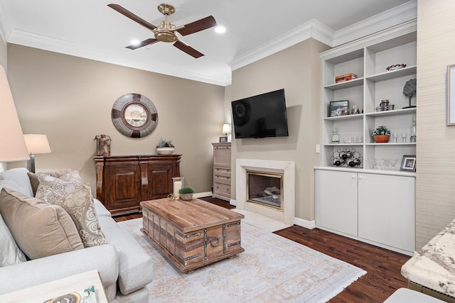 living room featuring ceiling fan, hardwood / wood-style floors, and ornamental molding