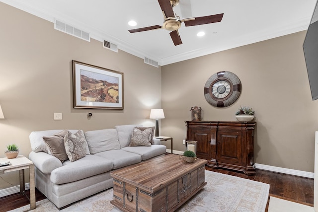 living room featuring light hardwood / wood-style floors, ceiling fan, and ornamental molding