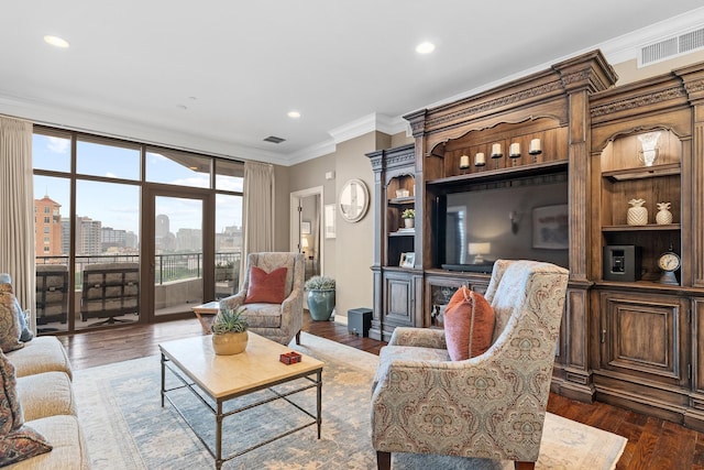 living room with dark hardwood / wood-style flooring and crown molding