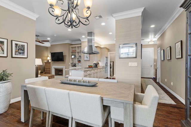 dining room featuring ornamental molding, ceiling fan with notable chandelier, and dark wood-type flooring