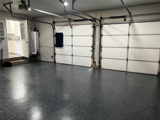 garage featuring a garage door opener and gas water heater