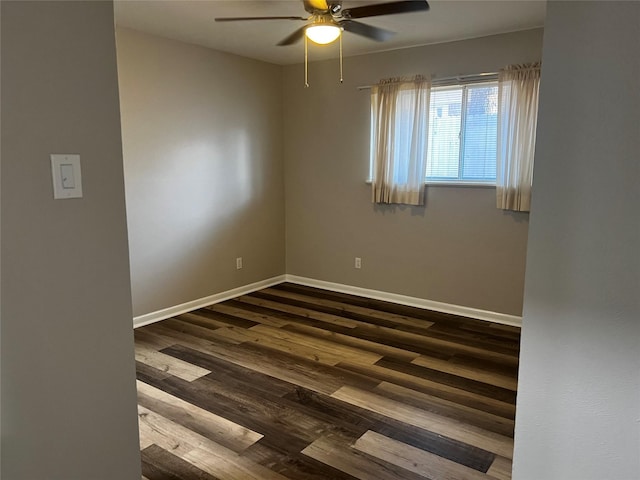 empty room featuring dark hardwood / wood-style floors and ceiling fan