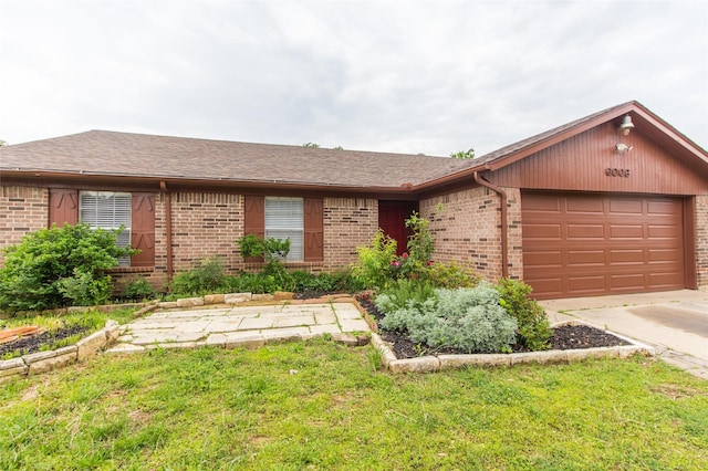 ranch-style home featuring a front lawn and a garage