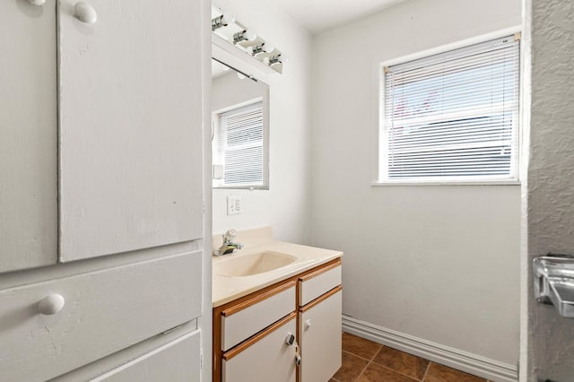 bathroom featuring tile patterned flooring and vanity