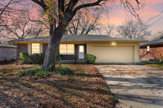 single story home featuring a garage