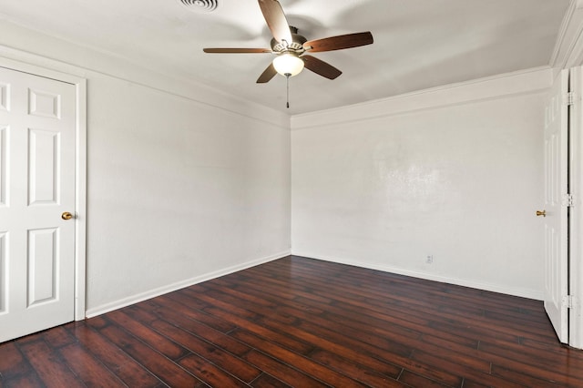 spare room featuring dark hardwood / wood-style flooring, ceiling fan, and ornamental molding