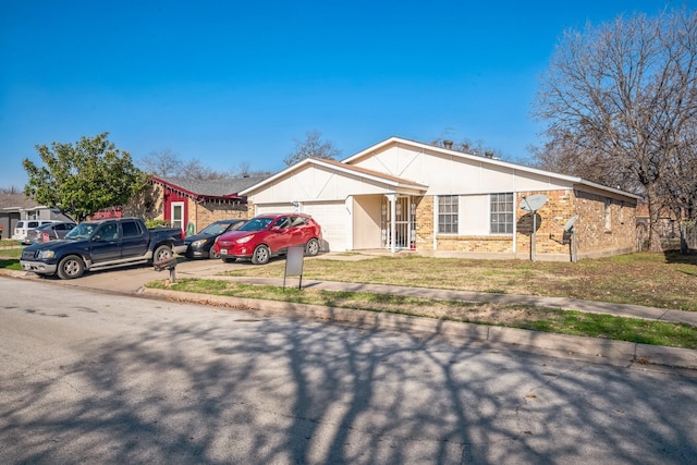 ranch-style home with a garage