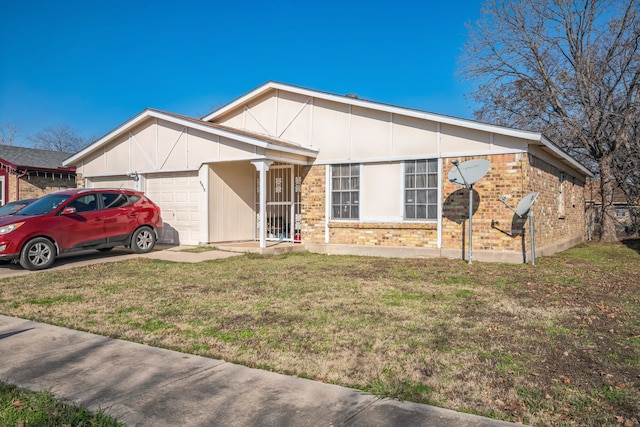 view of front of home with a garage and a front lawn