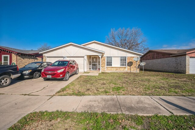 single story home with a garage and a front lawn