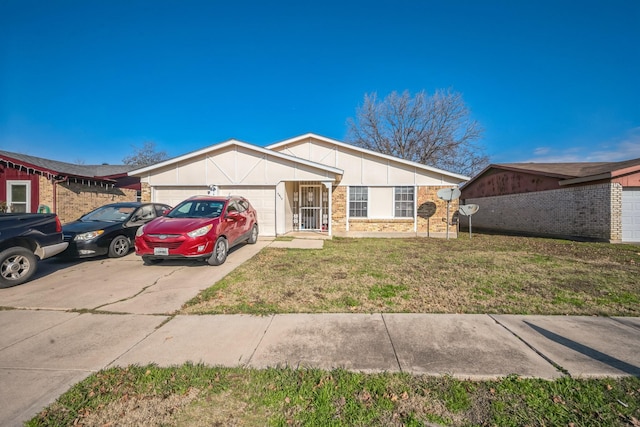 ranch-style house featuring a garage and a front lawn