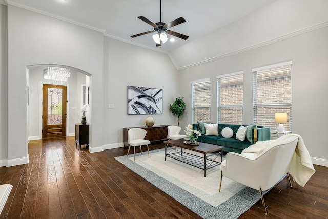 living room with ornamental molding, dark hardwood / wood-style flooring, ceiling fan, and lofted ceiling