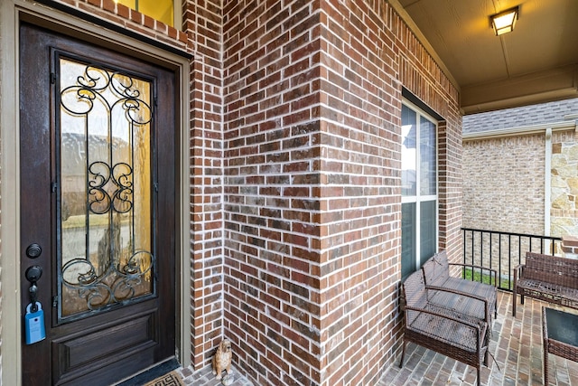 doorway to property featuring covered porch