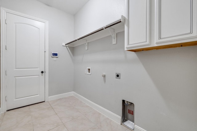 laundry room featuring cabinets, washer hookup, hookup for an electric dryer, gas dryer hookup, and light tile patterned floors