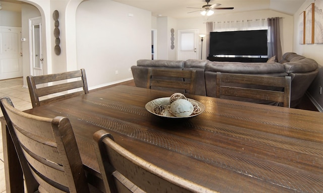 dining space with lofted ceiling and ceiling fan