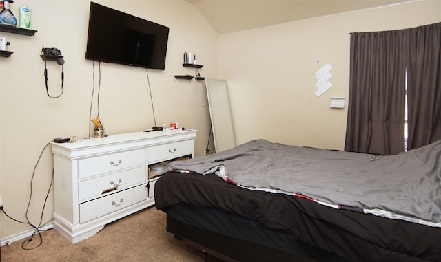 carpeted bedroom featuring vaulted ceiling