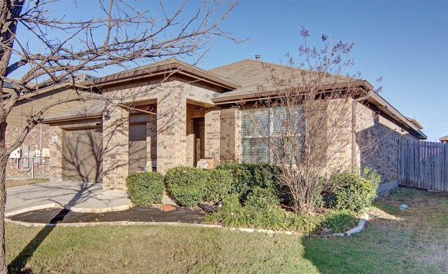 view of front facade with a front yard, a garage, and cooling unit