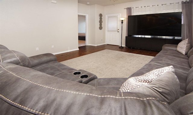 living room with dark hardwood / wood-style flooring