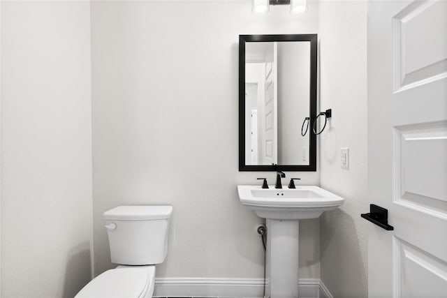 bathroom with sink and toilet