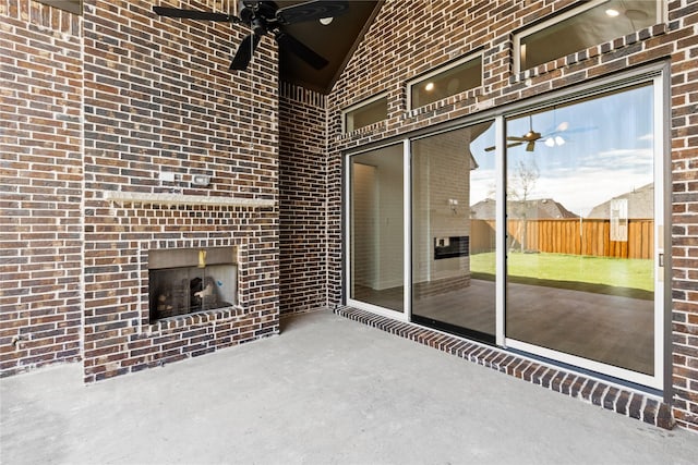 view of patio with an outdoor fireplace