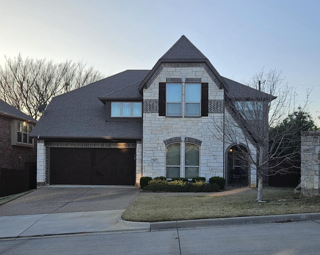 view of front of home with a garage and a front yard