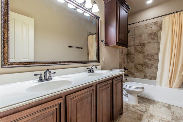 full bath featuring shower / bath combo, a sink, toilet, and double vanity