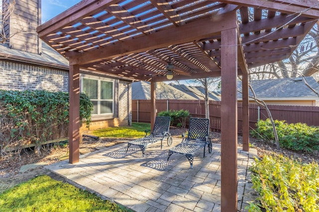 view of patio / terrace featuring fence and a pergola