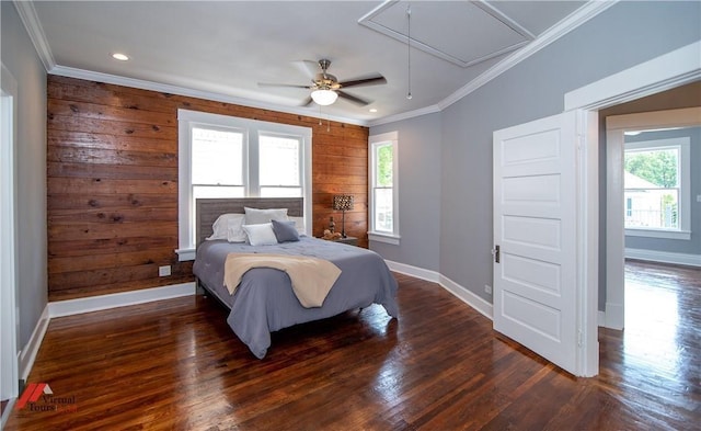 bedroom with ceiling fan, wooden walls, dark hardwood / wood-style floors, and ornamental molding