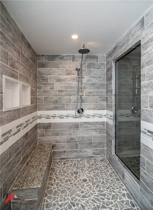 bathroom with tiled shower